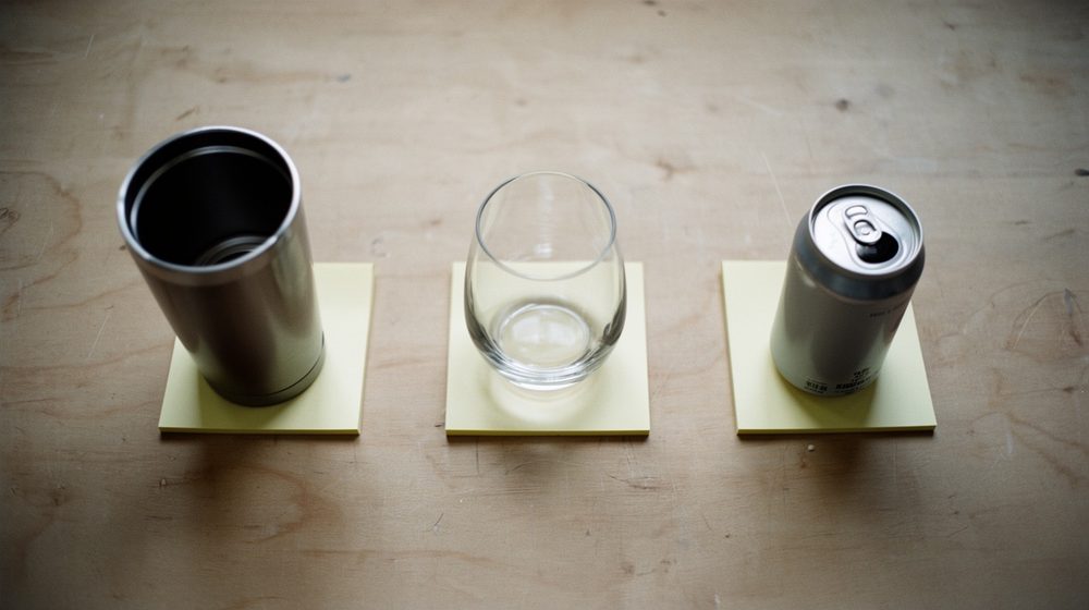A tumbler standing on a yellow sticky note, showing the three-inch test.